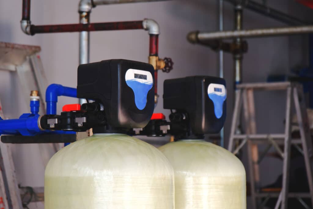 2 water softeners standing next to each other